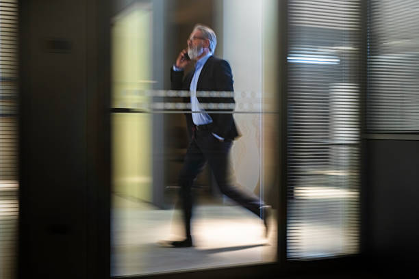 istock Businessman  walking along office  walkway 1126546912