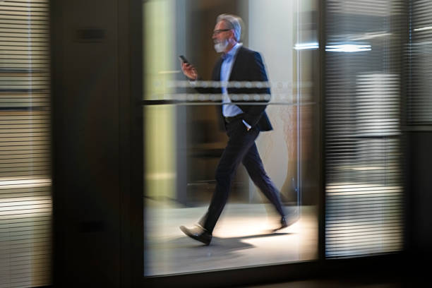 istock Businessman  walking along office  walkway 1126546991