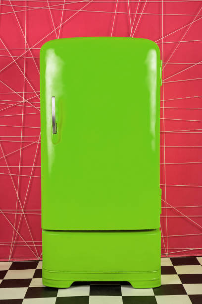 istock old vintage green refrigerator on a pink background 1126548058