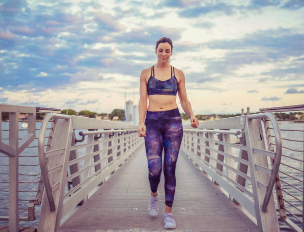 istock Runner, woman, on the waterfront exercising 1126562480