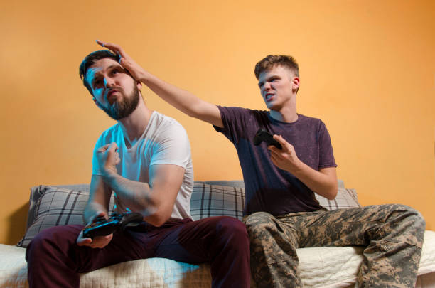 istock Aggressive teen while playing video games 1126563180