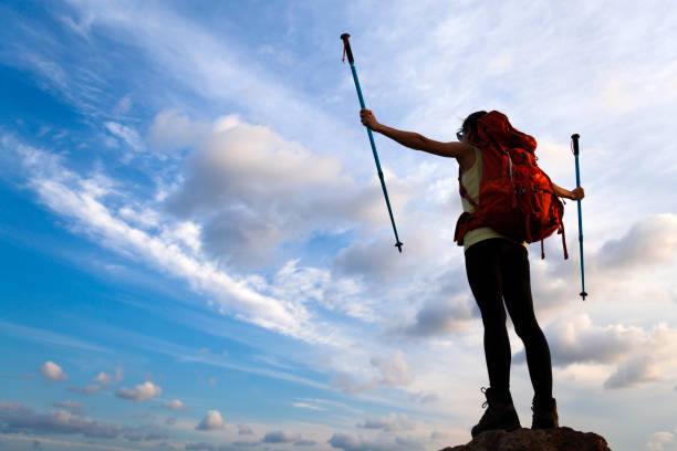 istock Woman Silhouette at sunset on hill 1126570583