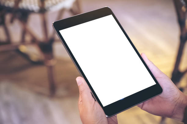 istock a woman holding black tablet pc with blank white screen 1126578854