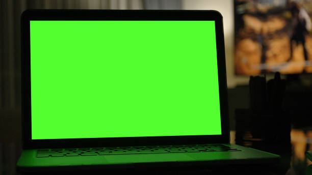 istock Close-up shot , Laptop with green screen indoors for replacement with blur background 1126579022