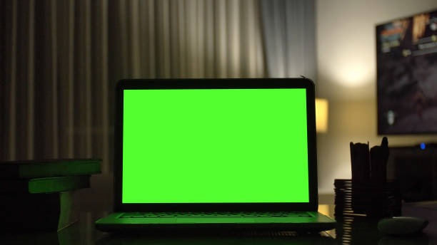 istock Close-up shot , Laptop with green screen indoors for replacement with blur background 1126579031
