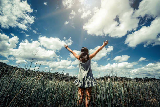 istock Young beautiful woman on green grass meadow 1126580153