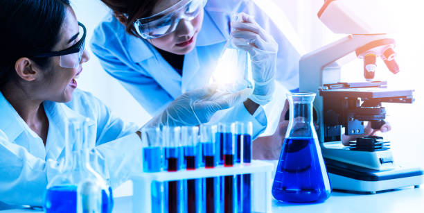istock Group of scientists wearing lab coat working in laboratory 1126584317