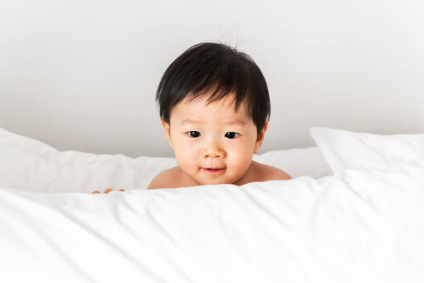 istock Closeup of a baby playing with a pillow 1126585924