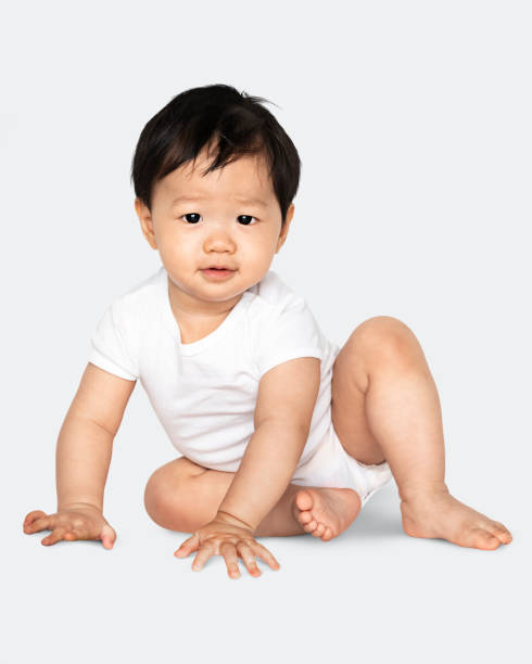 istock Baby sitting on the floor in a studio 1126585938