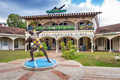 People eat on the terrace of Usain Bolt's Tracks & Records restaurant on the Hip Strip of Montego Bay Jamaica, with the 