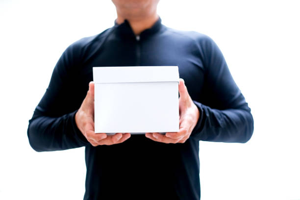 istock Man isolated on white with a surprise box or gift 1126589578