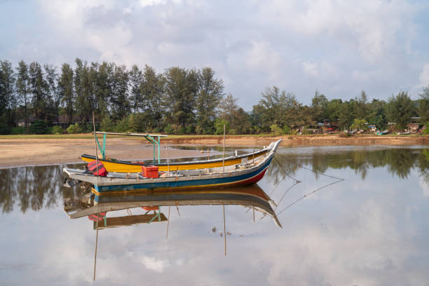 istock Beautiful view reflection fisherman boat at river 1126590399