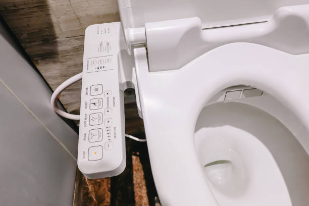 Modern high tech toilet with electronic bidet in Thailand. japan style toilet bowl, high technology sanitary ware. Modern high tech toilet with electronic bidet in Thailand. japan style toilet bowl, high technology sanitary ware. japanese toilet stock pictures, royalty-free photos & images