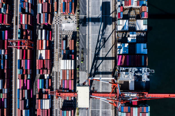 istock Containers are loaded onto transport ships. I use a large crane. 1126591653