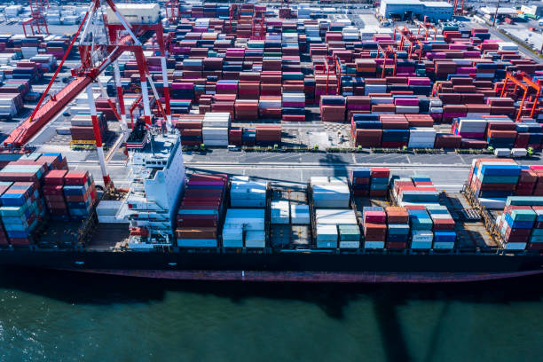 istock A large cargo ship loaded with many containers is fixed in the container area. 1126591676
