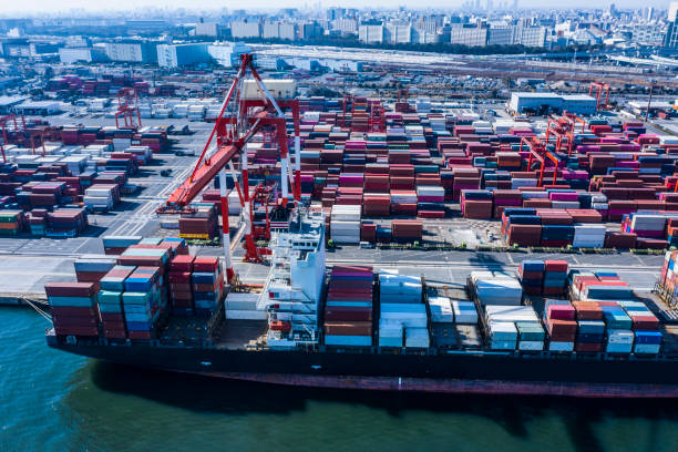 istock A large cargo ship loaded with many containers is fixed in the container area. 1126591683