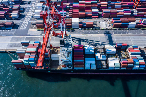 istock A large cargo ship loaded with many containers is fixed in the container area. 1126591684