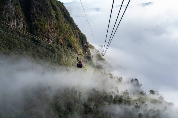 istock The cable car to mountain top with low clouds and mountain view 1126597557