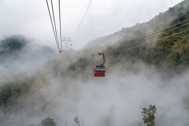 istock The cable car to mountain top with low clouds and mountain view 1126598568