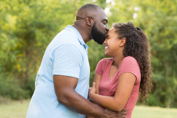 istock Father kissing his daughter. 1126601343