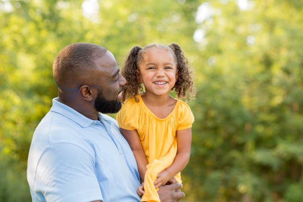 istock Father laughing and playing with his daugher. 1126601375