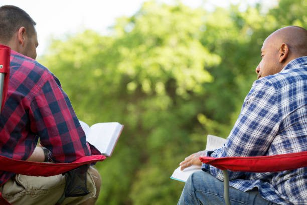 istock Multi-Ethnic group of friends talking and having a bible study. 1126601530