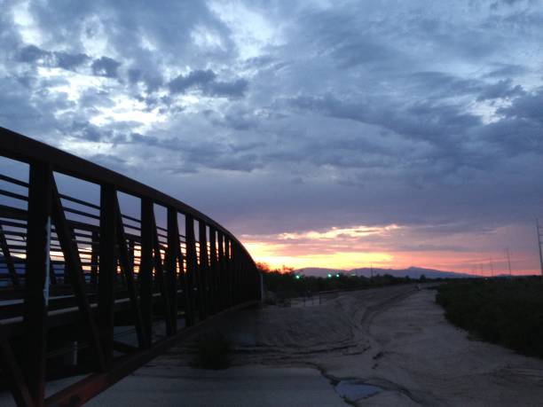 istock Bridge with contrasting sky behind.  Clouds, stormy, colorful photos 1126605557