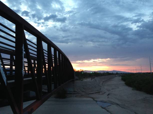istock Bridge with contrasting sky behind.  Clouds, stormy, colorful photos 1126605559