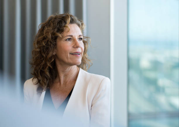 istock Confident businesswoman looking away at office 1126609441