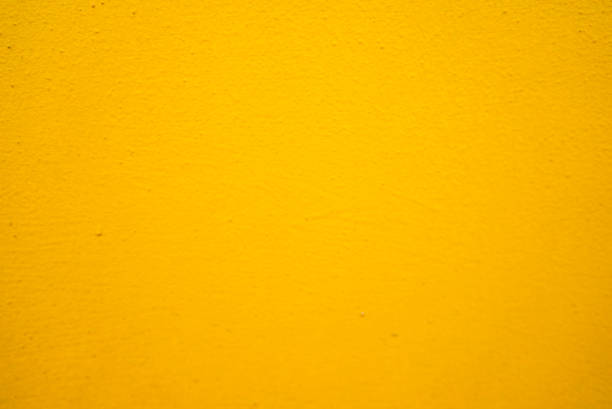 istock Old yellow stone wall texture – yellow wall pattern – old yellow gunge brick background 1126609525