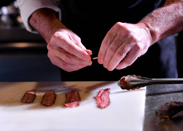 istock Chef preparing food, meal, in the kitchen, chef cooking, Chef decorating dish 1126610853