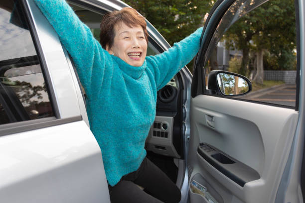 istock Japanese woman driving a car 1126612606