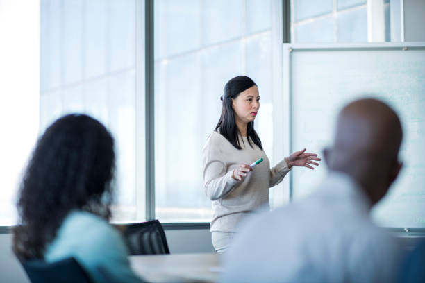 istock Confident businesswoman giving presentation 1126613526