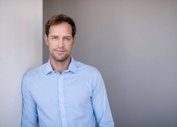 istock Portrait of confident entrepreneur leaning on wall 1126613977