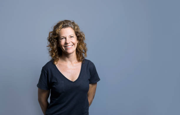 istock Smiling mature female entrepreneur by empty space 1126614727