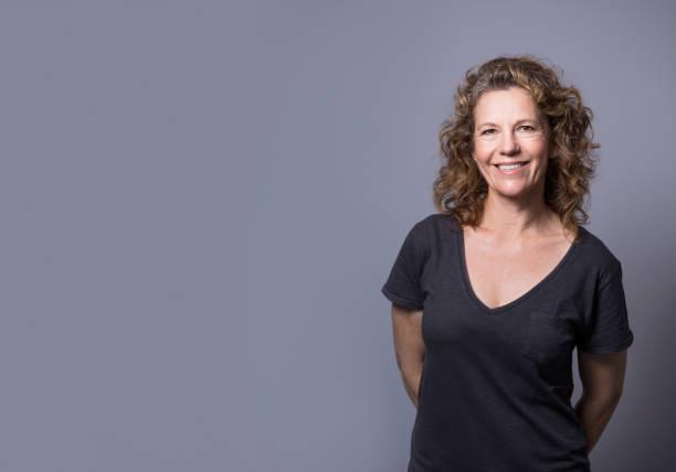 istock Smiling businesswoman standing by copy space 1126614785