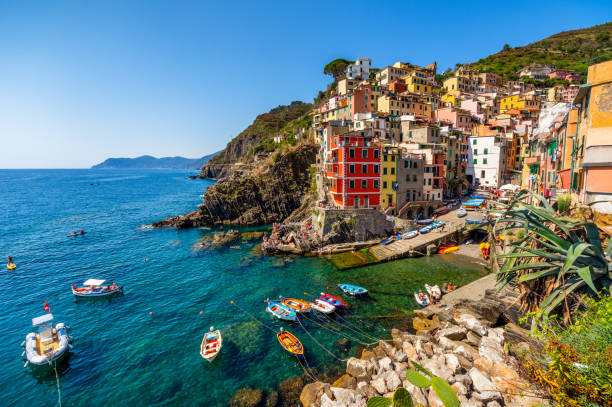 View of the village Riomaggiore. Cinque Terre National Park, Liguria Italy Wide ange view of the village Riomaggiore in Cinque Terre National Park, Liguria Italy fishing village stock pictures, royalty-free photos & images