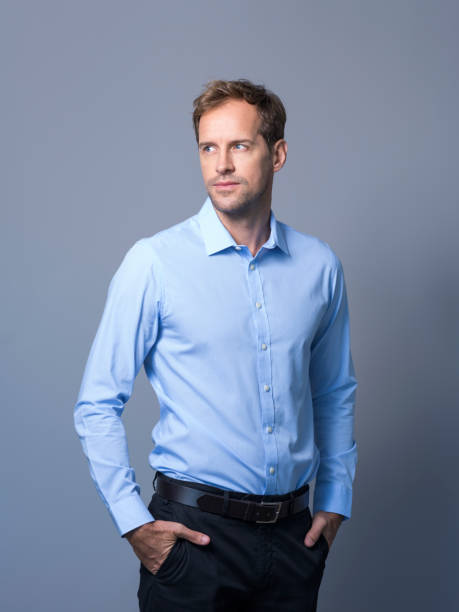 istock Businessman with hands in pockets looking away 1126614896