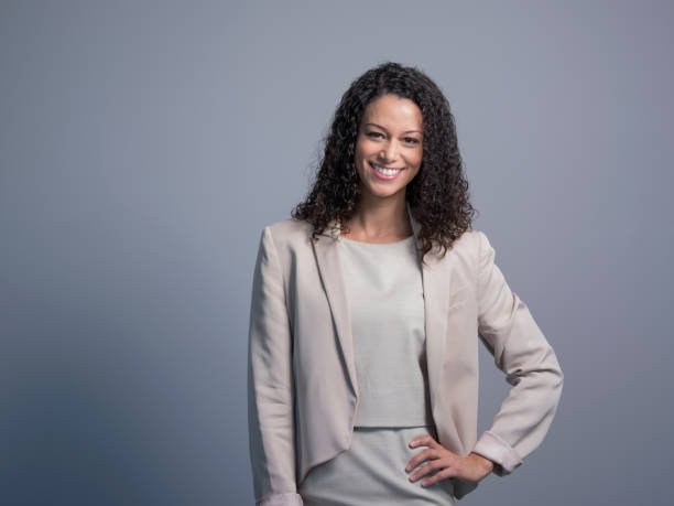istock Manager with hand on hip over gray background 1126615001