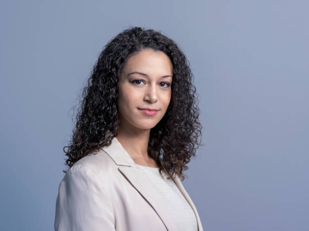 istock Confident businesswoman against gray background 1126615021