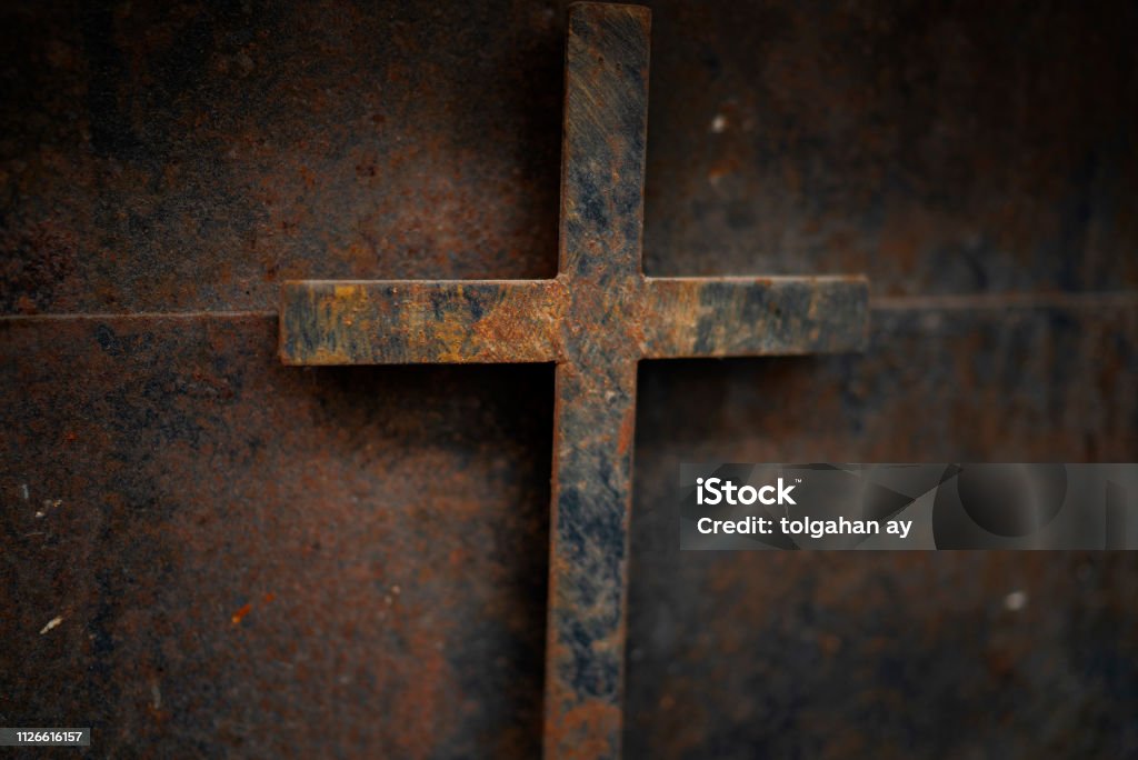 rusty cross - old and rusty cross iron door – rusty grunge background Close-up Stock Photo