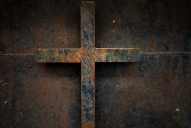 istock rusty cross - old and rusty cross iron door – rusty grunge background 1126616158