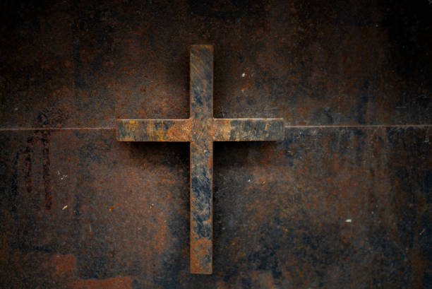 istock rusty cross - old and rusty cross iron door – rusty grunge background 1126616159