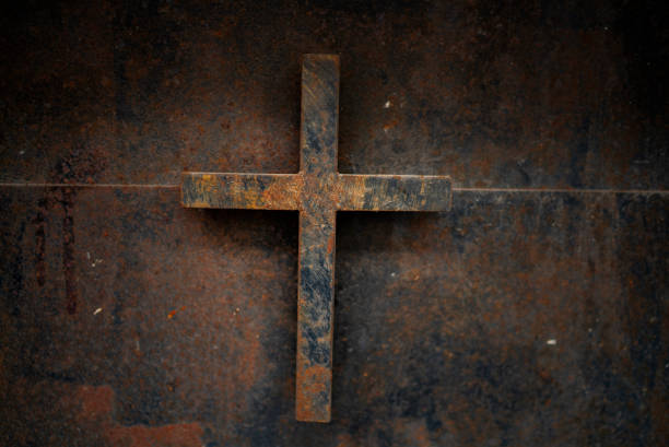 istock rusty cross - old and rusty cross iron door – rusty grunge background 1126616160