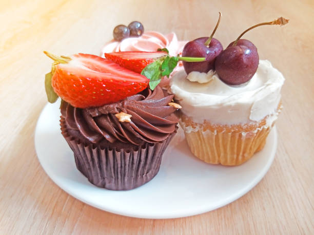istock set of cupcakes in dish on wood table 1126617439