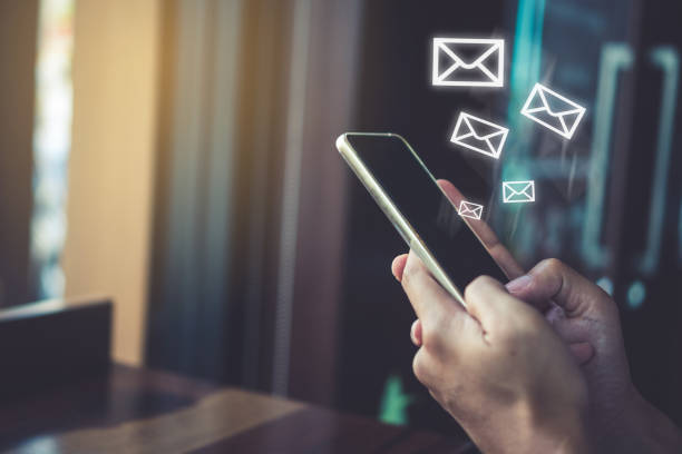 istock Woman hand using smartphone and it's show 1 email recieve notification icon pop up on screen of mobile phone. Business communication  technology concept. 1126617594
