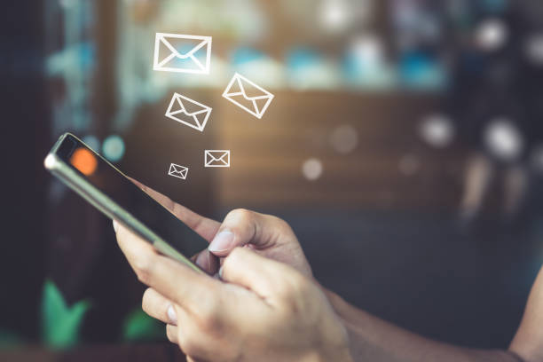istock Woman hand using smartphone and it's show 1 email recieve notification icon pop up on screen of mobile phone. Business communication  technology concept. 1126617606