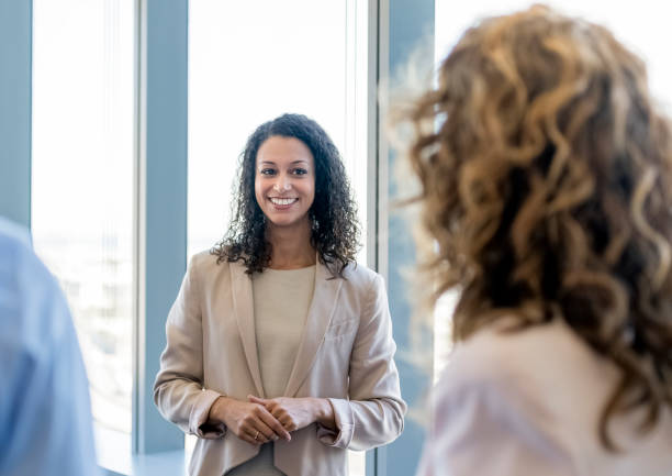 istock Smiling businesswoman planning with colleagues 1126620084
