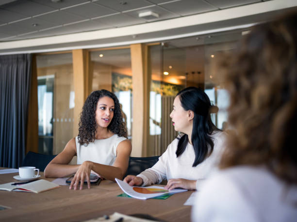 istock Businesswomen discussing at conference table 1126620145