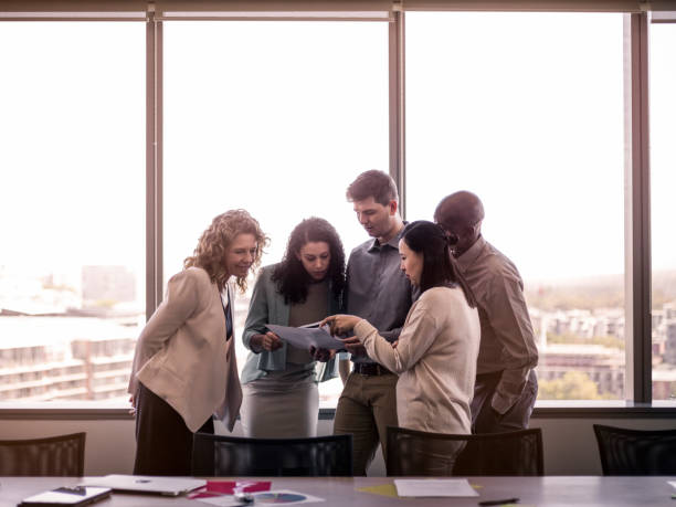 istock Business professionals reading document in meeting 1126621490